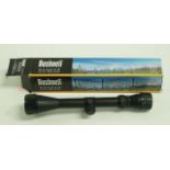 A metal Bushnell 3-9 x 40 rifle scope,