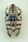 A sapphire, diamond and ruby set beetle brooch,