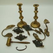 A pair of brass candlesticks, a brass gavel,
