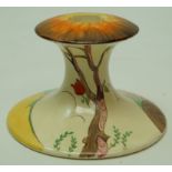 A Clarice Cliff pottery candlestick, painted in coloured enamels with a stylised landscape,