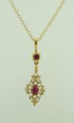 A 9 carat gold ruby and diamond pendant, on a chain, pendant 3cm long, chain 40cm long, 3.