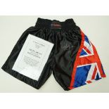 A signed pair of boxing shorts, signed by Nigel Benn,