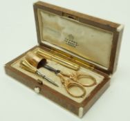 A French gold necessaire, comprising a thimble, scissors; needle case and a bradle,