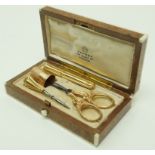 A French gold necessaire, comprising a thimble, scissors; needle case and a bradle,