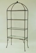 A four tier metal framed étagerè with ball finial enclosing two glass shelves, 198cm high,