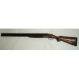 A 12 bore, Saraquetta shotgun, box lock, over and under, choke 1/4 + 3/4, serial number 104215,