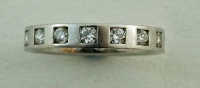 A platinum and diamond eternity ring, the sixteen brilliant cuts totalling approximately 0.