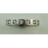 A platinum and diamond eternity ring, the sixteen brilliant cuts totalling approximately 0.