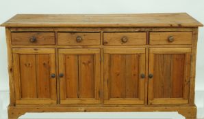 A pine dresser base with four drawers,