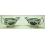 A pair of Worcester moulded sauce boats, printed on blue with flowers, open crescent mark,