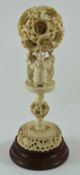 A large late 19th century Chinese carved ivory concentric ball on stand,
