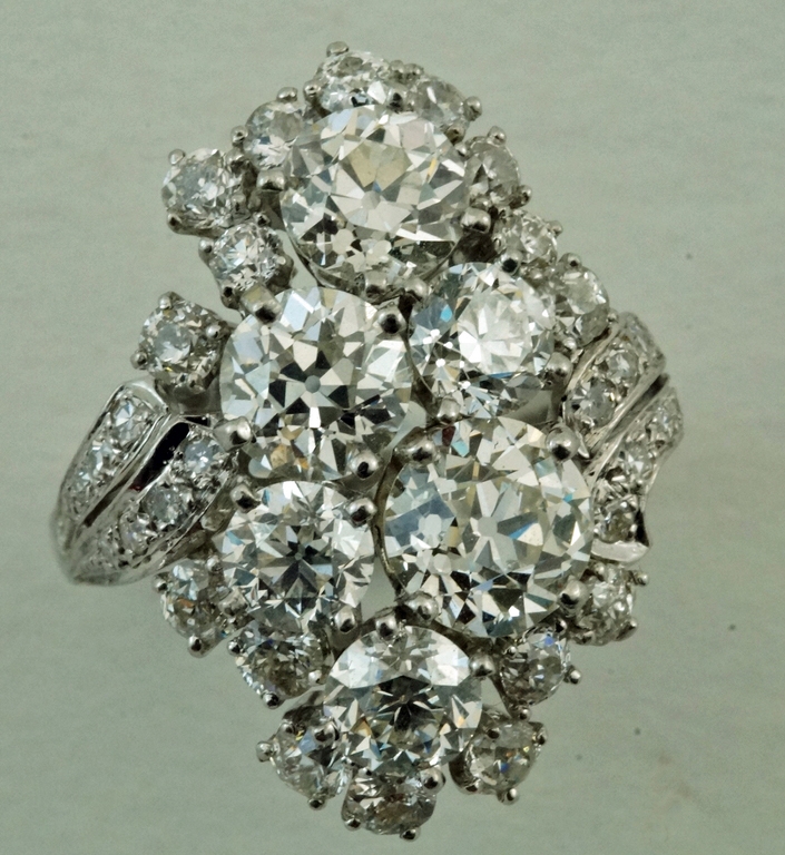 A large diamond cluster ring, stamped 'Plat',