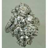 A large diamond cluster ring, stamped 'Plat',