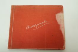 An early 20th century autograph book containing approximately twelve sketches,