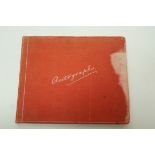 An early 20th century autograph book containing approximately twelve sketches,