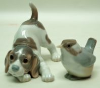 A Lladro porcelain figure of a puppy crouching, factory marks in blue,
