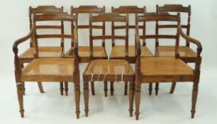 A set of seven William IV mahogany chairs with rail backs and turned legs,