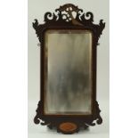 A George II style fret frame wall mirror, the pierced crest with parcel gilt eagle,