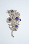 A diamond and amethyst Victorian style foliate spray brooch, set throughout with old brilliant cuts,