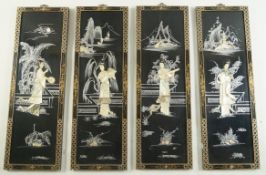 A set of four Chinese lacquered wall panels each inlaid with mother of pearl and painted with