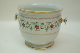 A 20th century Sèvres jardiniere decorated with a band of scrolling flowers and gilt,