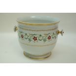 A 20th century Sèvres jardiniere decorated with a band of scrolling flowers and gilt,