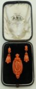 A pair of Victorian carved coral pair of earrings and brooch,