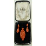 A pair of Victorian carved coral pair of earrings and brooch,