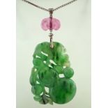 A carved jade pendant, the jade carved as a peach,