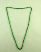 A uniform row of jade beads, the one hundred and eight beads of approximately 9mm diameter,
