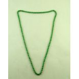 A uniform row of jade beads, the one hundred and eight beads of approximately 9mm diameter,