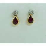 A pair of ruby and diamond earrings,