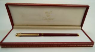 A Cartier Must de Cartier Stylo d'Plume fountain pen, 18 carat gold medium nib, cartridge fill,
