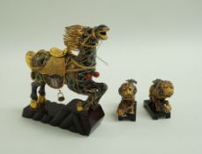 A pair of gilt metal and enamel figures of dogs of Fo each on a rectangular japanned plinth, 9.