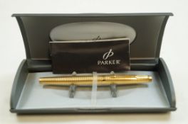 A Parker Duofold 75 pen, yellow metal Godrun pattern, 14 carat gold medium nib,