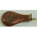 An embossed copper powder flask,