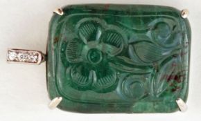 A rectangular carved emerald pendant, with diamond set bale, the stone measuring approximately 3.