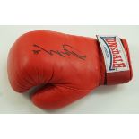 A red Lonsdale boxing glove, signed by Jamie Moore,