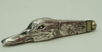 A cigar cutter in the form of a ducks head, apparently unmarked, 14.