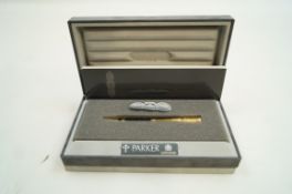 A Parker Duofold ball pen, black with trim,