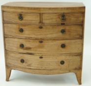 A George IV mahogany bow fronted chest of two short and three long drawers on splayed feet,