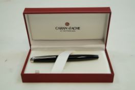 A Caran d'Ache Lehman black fountain pen with 18 carat gold medium nib,