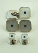 A set of mother of pearl and sapphire cufflinks, the white mounts marked '9ct',