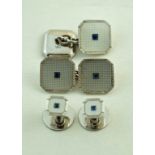 A set of mother of pearl and sapphire cufflinks, the white mounts marked '9ct',