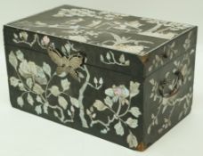 A 19th century lacquered rectangular box inset with mother of pearl flowering branches and a