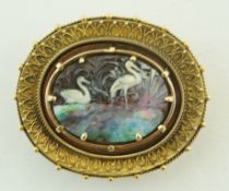 A 19th century gold oval boulder opal cameo brooch,