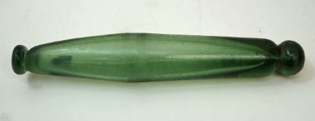 A late 19th century green glass rolling pin with hollow interior, 33.
