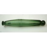 A late 19th century green glass rolling pin with hollow interior, 33.