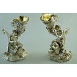 A pair of plated figural, dolphin and shell table salts, after the antique,