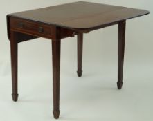 A 19th century mahogany pembroke table with two drop ends on square tapering legs with spade feet,